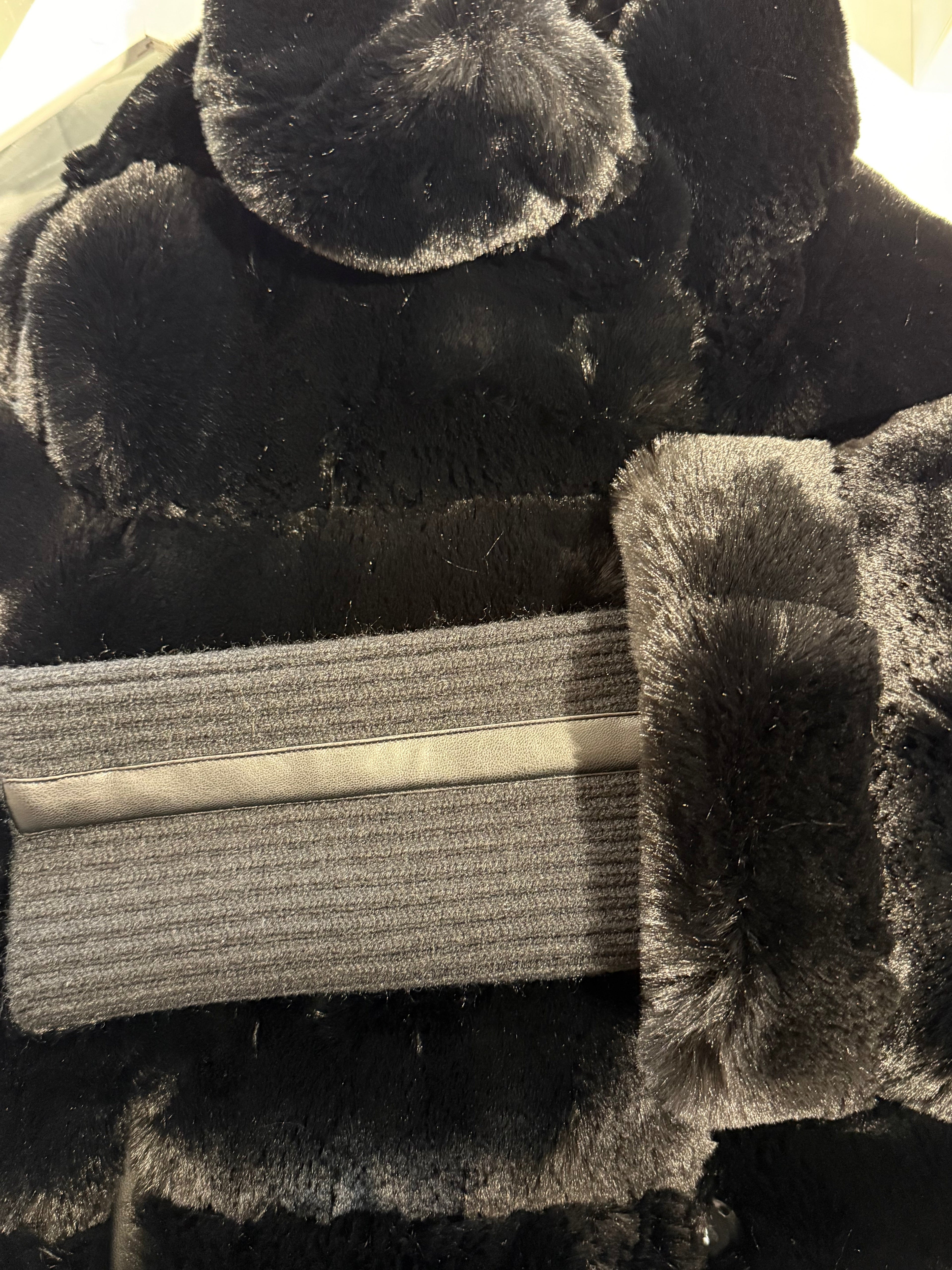 Faux fur jacket with knitted sleeves